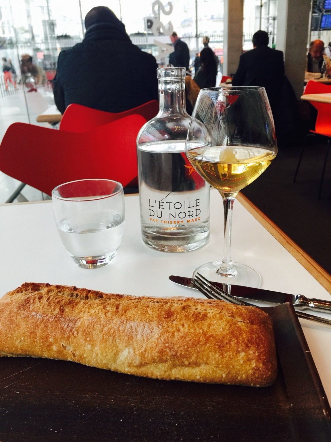 Baguette and a glass of wine at a Paris café